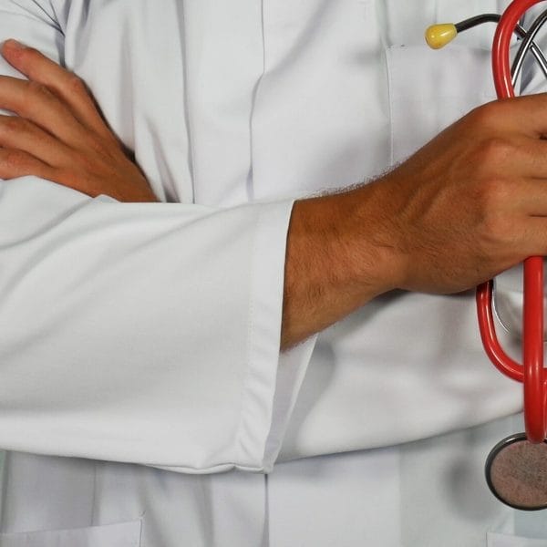 Doctor holds stethoscope.